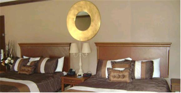 Отель Talbot Trail Inn & Suites