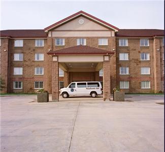 Отель Woodlands Inn & Suites