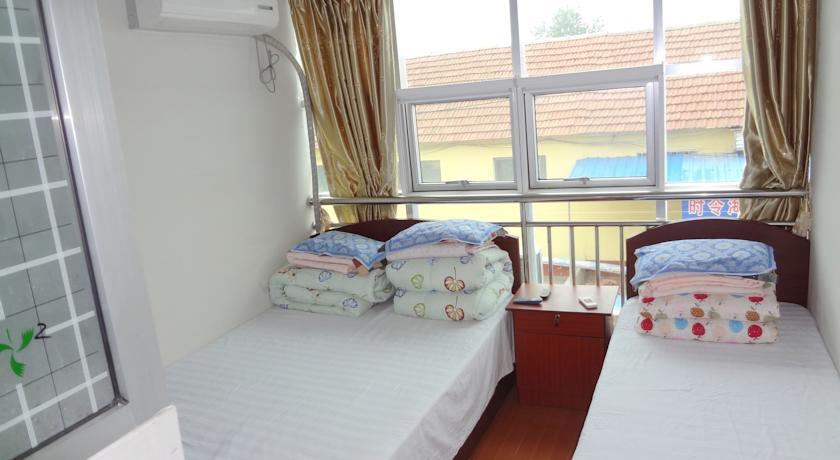 Отель Rizhao Hongqiang Yujia Hotel