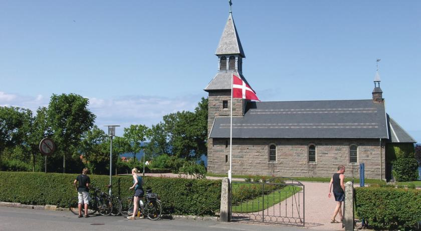 Апартаменты Købmandsgården Gudhjem Denm