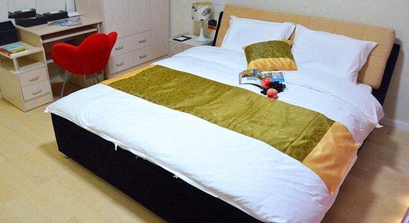 Апартаменты Yantai Sweetome Vacation ApartHotel (Yindu Fortune Center)