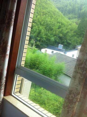 Отель Mogan Mountain Si He Guesthouse