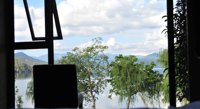 Отель Lugu Lake Caoshe Vacation Inn
