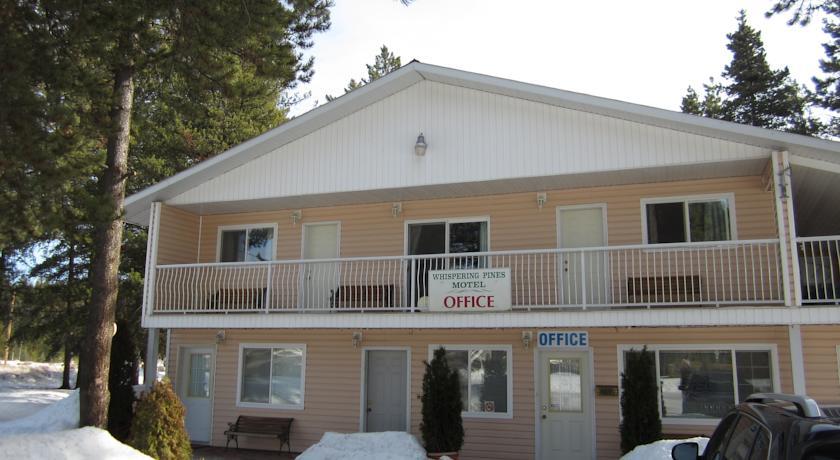 Отель Whispering Pines Motel & Cabins