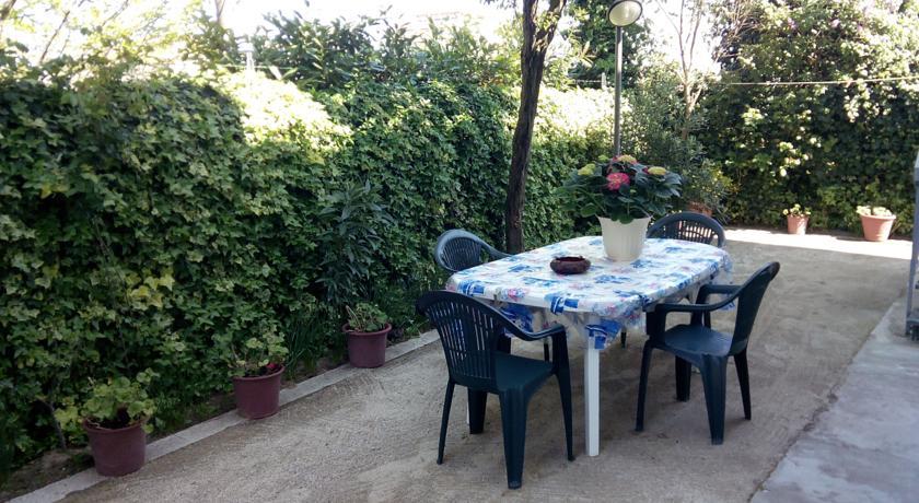 Апартаменты Villa Elegante Con Terrazzo E Giardino