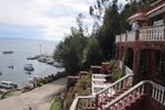 Отель Flores Del Lago Hostal